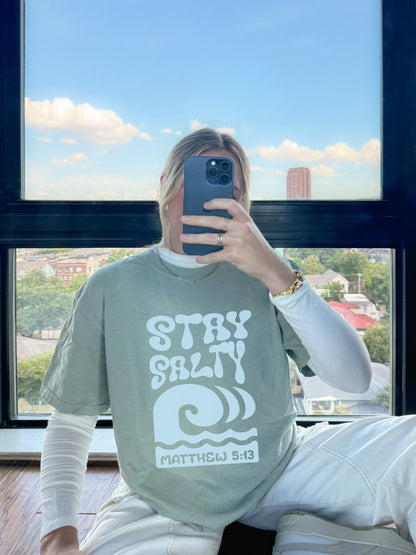 Christian t-shirt with 'Stay Salty' text and ocean wave design referencing Matthew 5:13