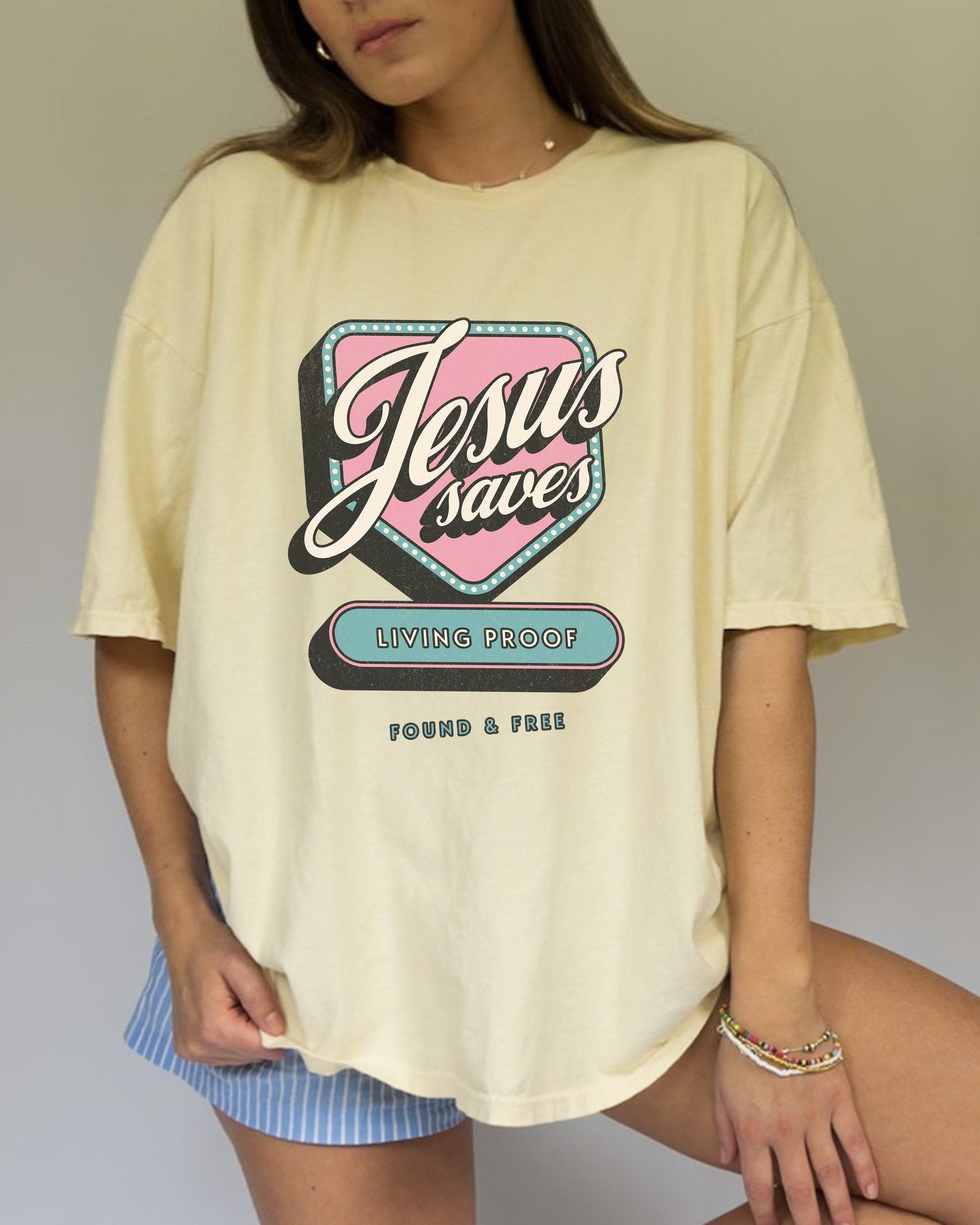 T-shirt with retro Jesus Saves design in pink and blue with distressed vintage styling