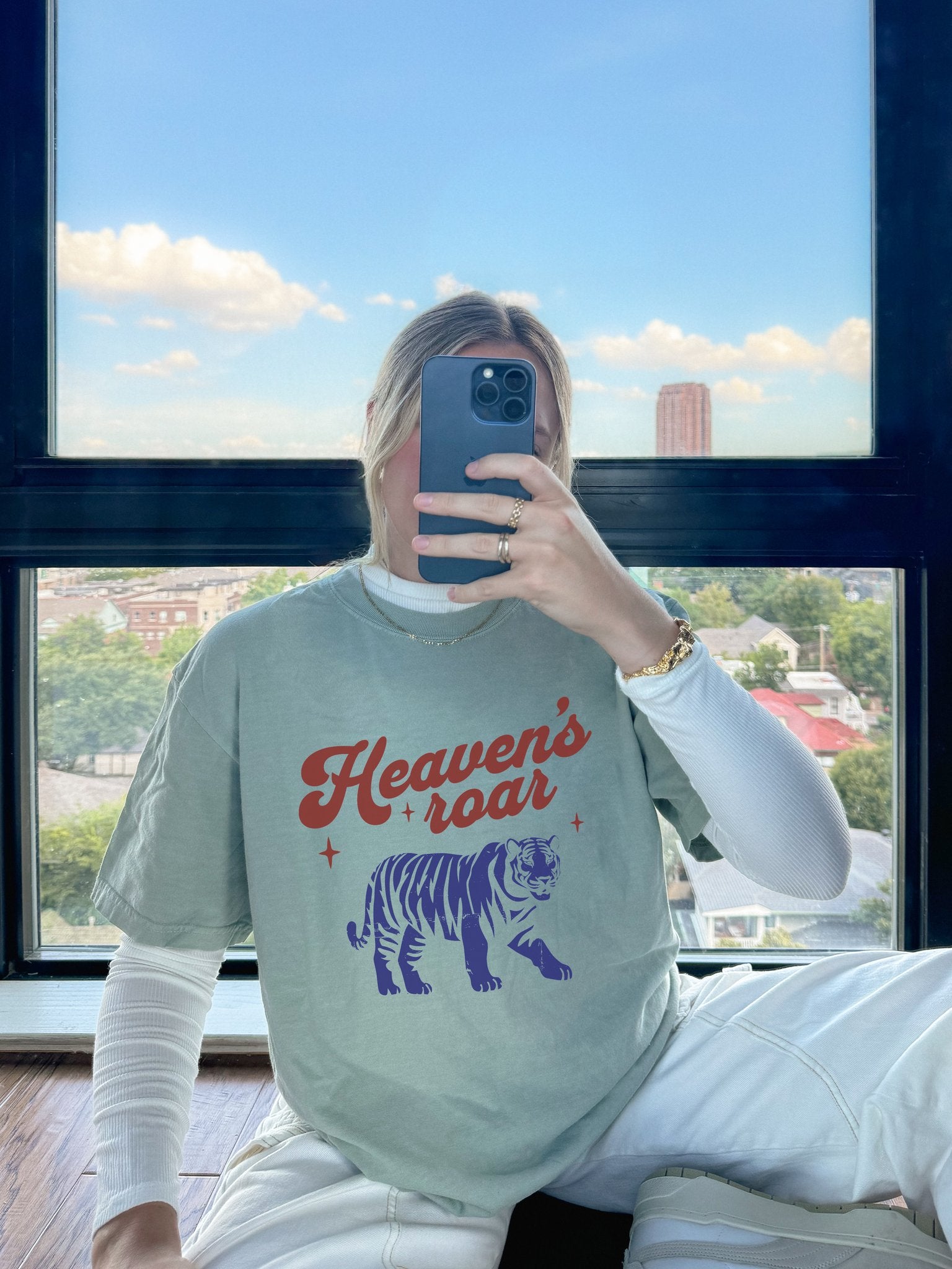 T-shirt with retro Heaven's roar text in red and blue tiger graphic design