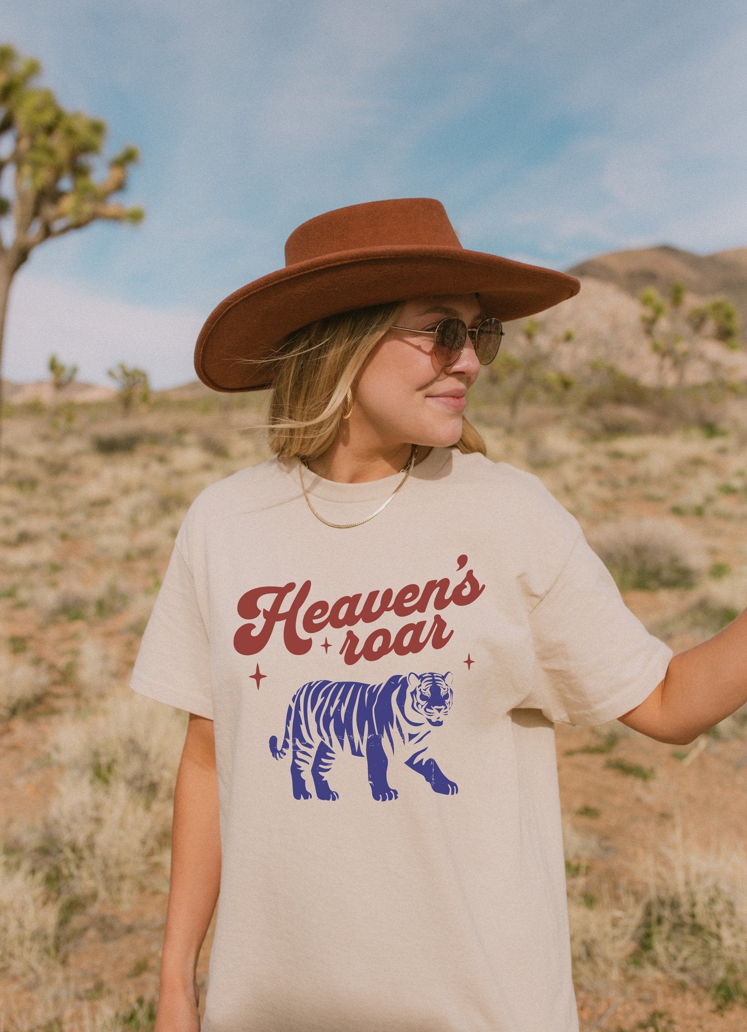 T-shirt with retro Heaven's roar text in red and blue tiger graphic design