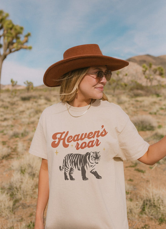 Christian t-shirt with Heaven's roar text in orange retro font and tiger graphic with stars