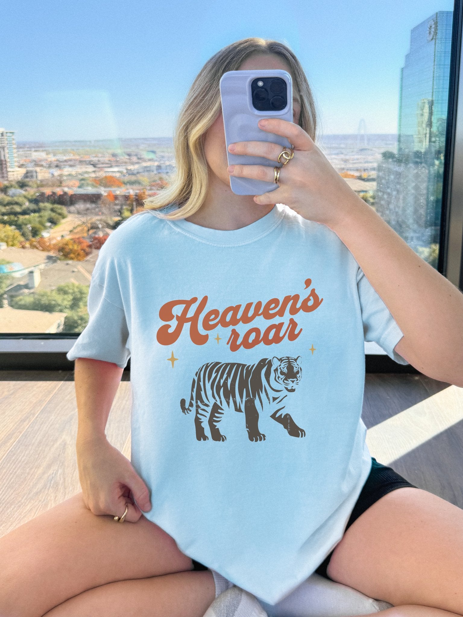 Christian t-shirt with Heaven's roar text in orange retro font and tiger graphic with stars