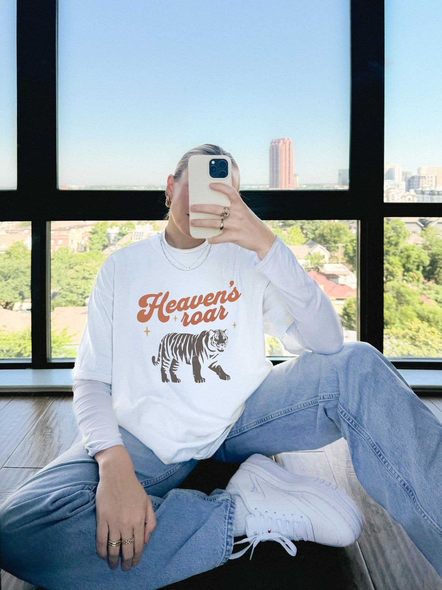 Christian t-shirt with Heaven's roar text in orange retro font and tiger graphic with stars