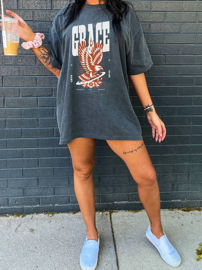 Christian t-shirt with vintage eagle design in orange and cream colors featuring Grace text and decorative elements