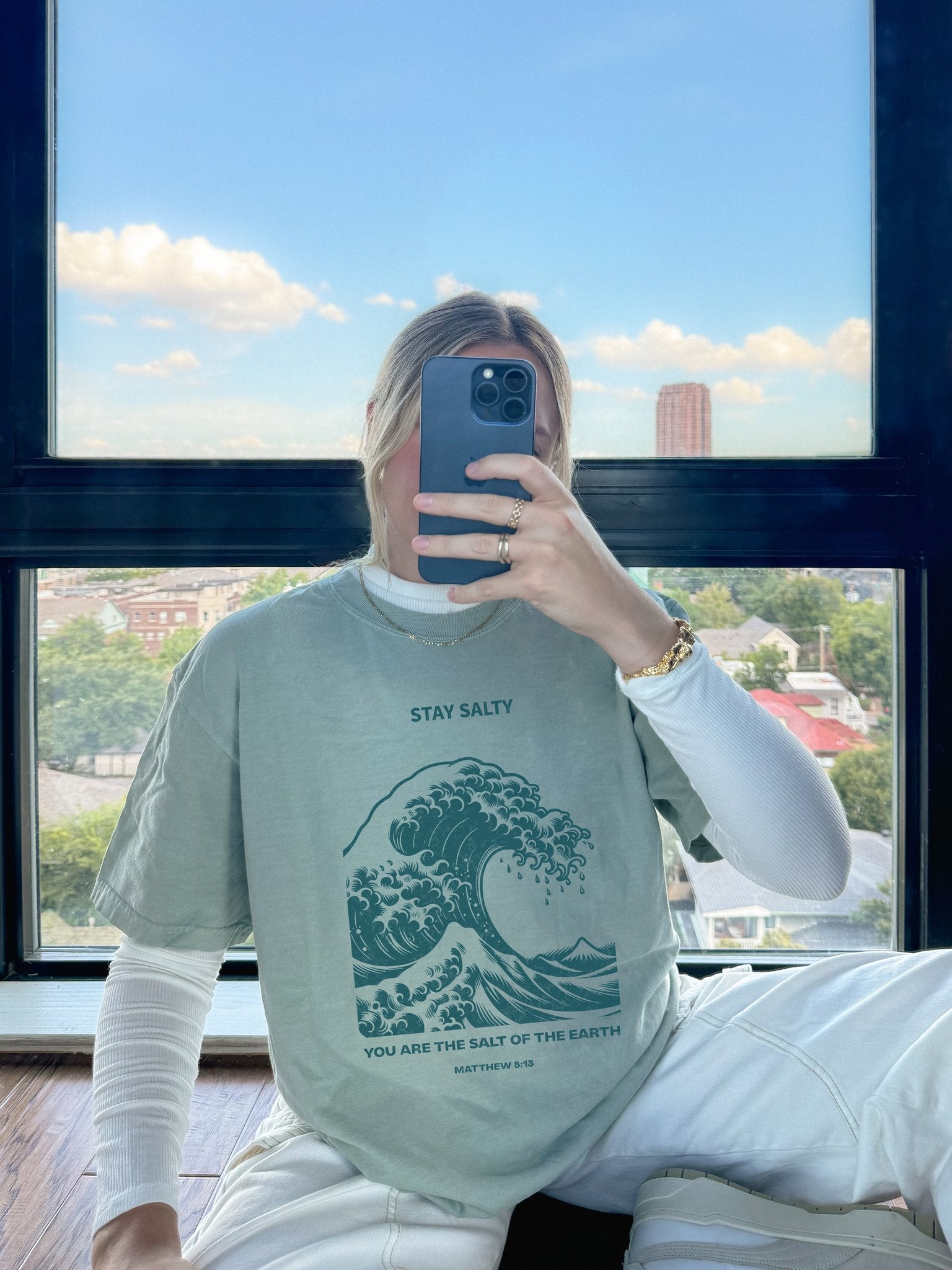 T-shirt with ocean wave design featuring Stay Salty text and Matthew 5:13 Bible verse