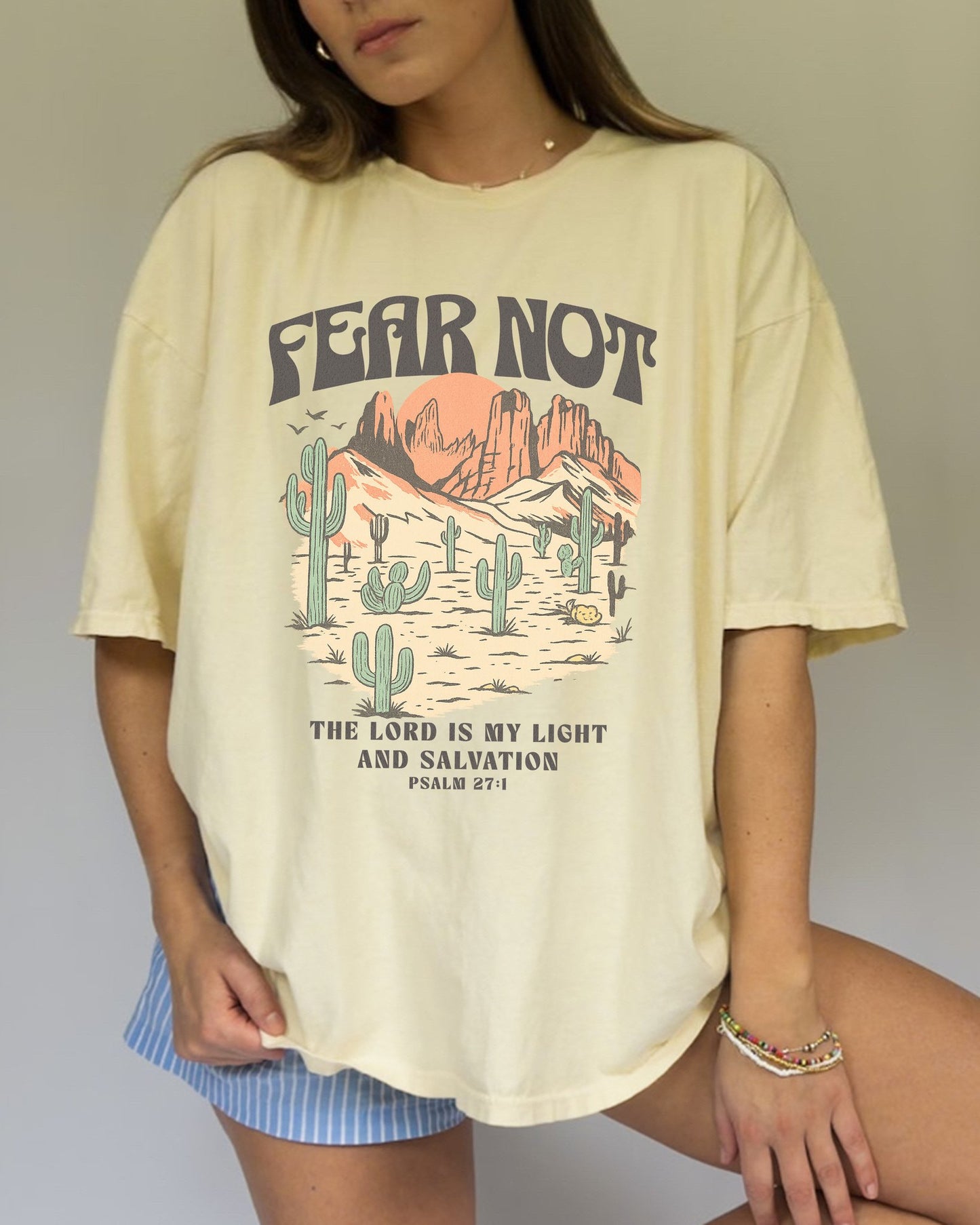 T-shirt with Fear Not text above desert scene with cacti, red rocks, and Psalm 27:1 verse below