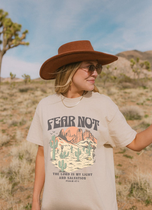 T-shirt with Fear Not text above desert scene with cacti, red rocks, and Psalm 27:1 verse below