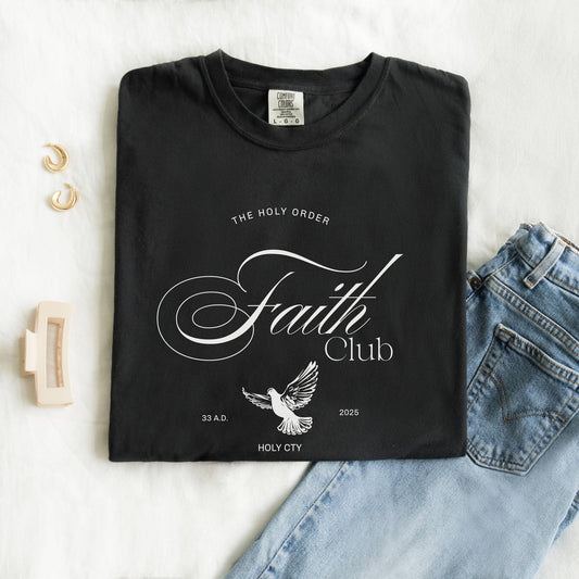 T-shirt with The Holy Order Faith Club text in elegant script with dove design and 33 A.D. Holy City details