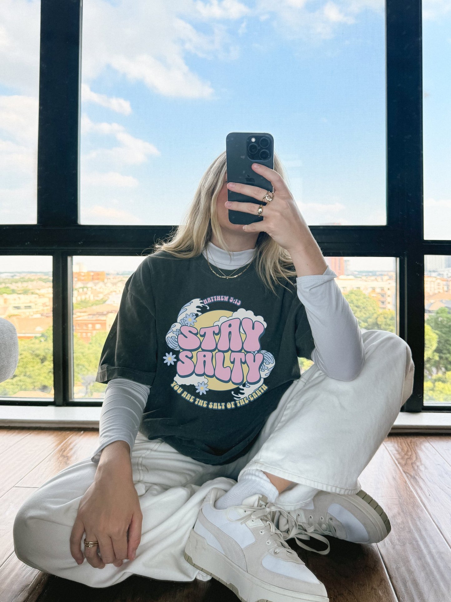 Christian t-shirt with pink 'Stay Salty' text, Matthew 5:13 verse, ocean waves and daisy flowers