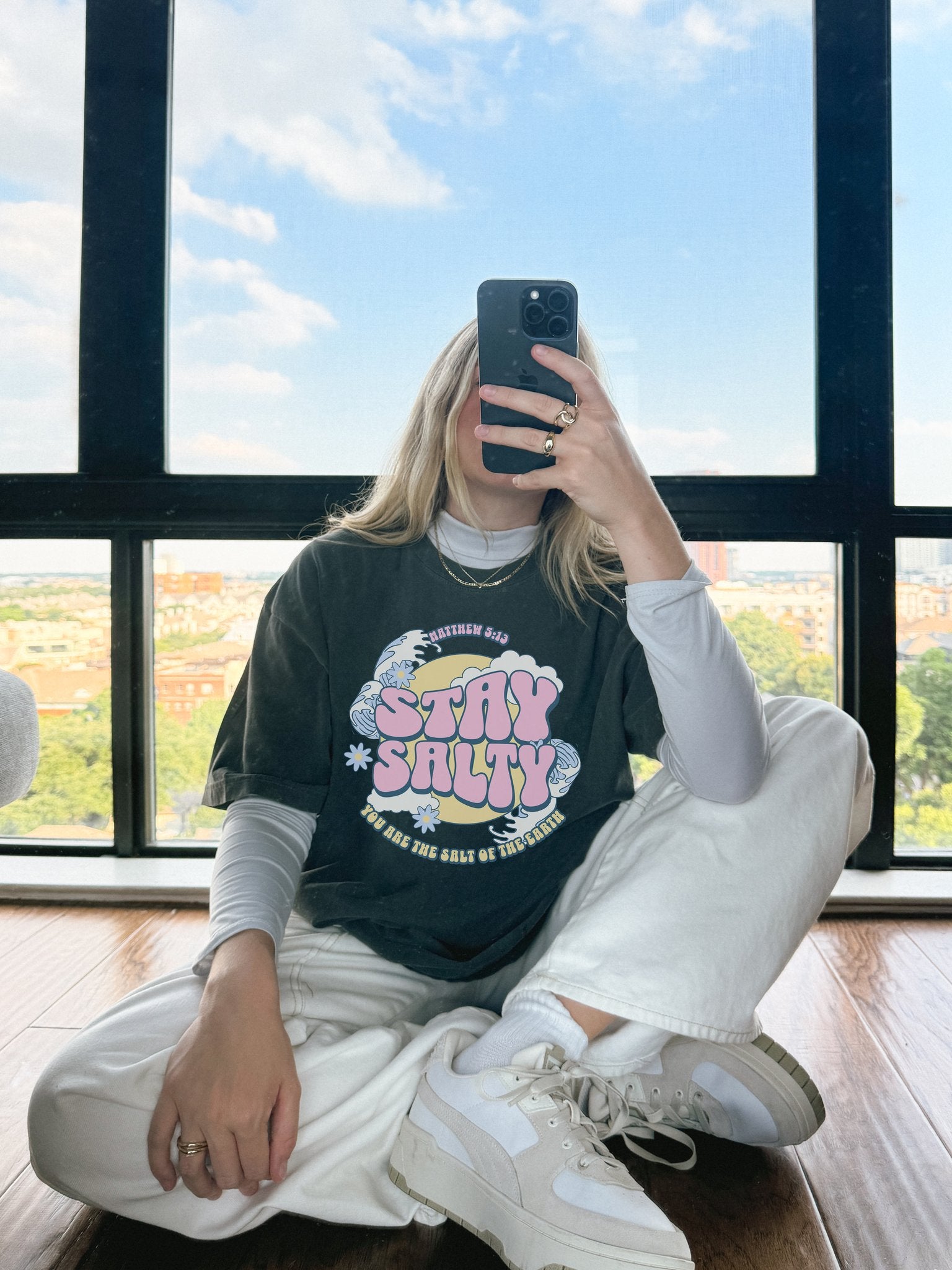 Christian t-shirt with pink 'Stay Salty' text, Matthew 5:13 verse, ocean waves and daisy flowers