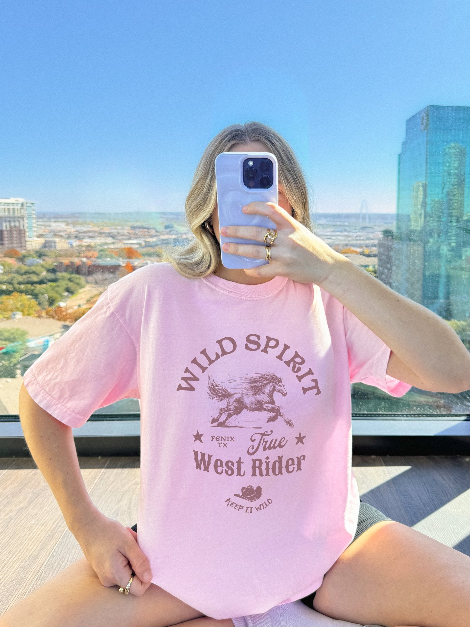 Western t-shirt with galloping horse design, Fenix Texas text, and cowboy hat graphic in vintage style