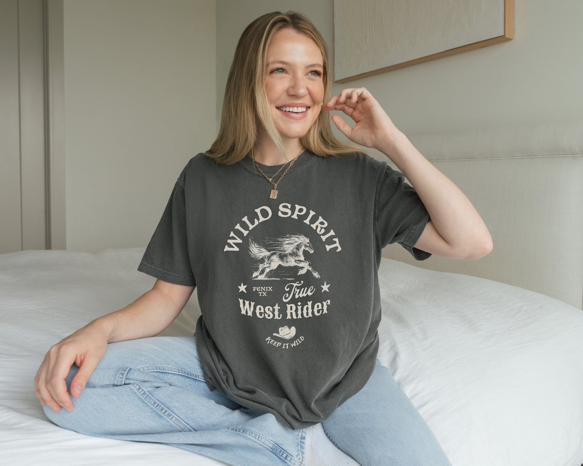 Western t-shirt with galloping horse design, Fenix Texas text, and cowboy hat graphic in vintage style