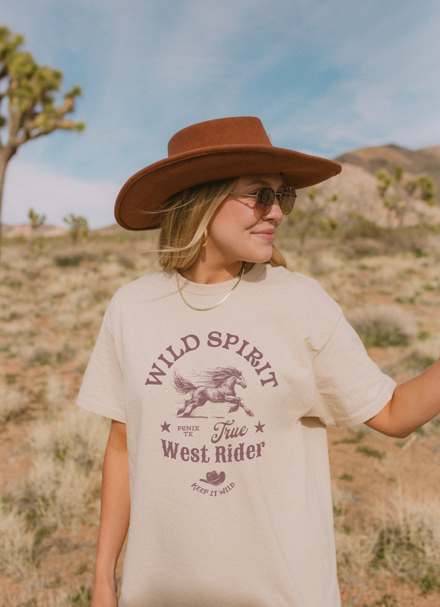 Western t-shirt with galloping horse design, Fenix Texas text, and cowboy hat graphic in vintage style