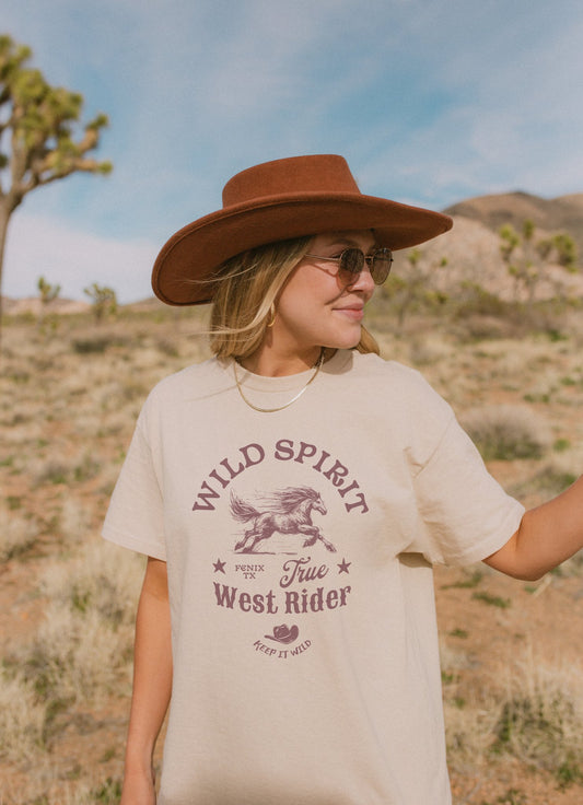 Western t-shirt with galloping horse design, Fenix Texas text, and cowboy hat graphic in vintage style