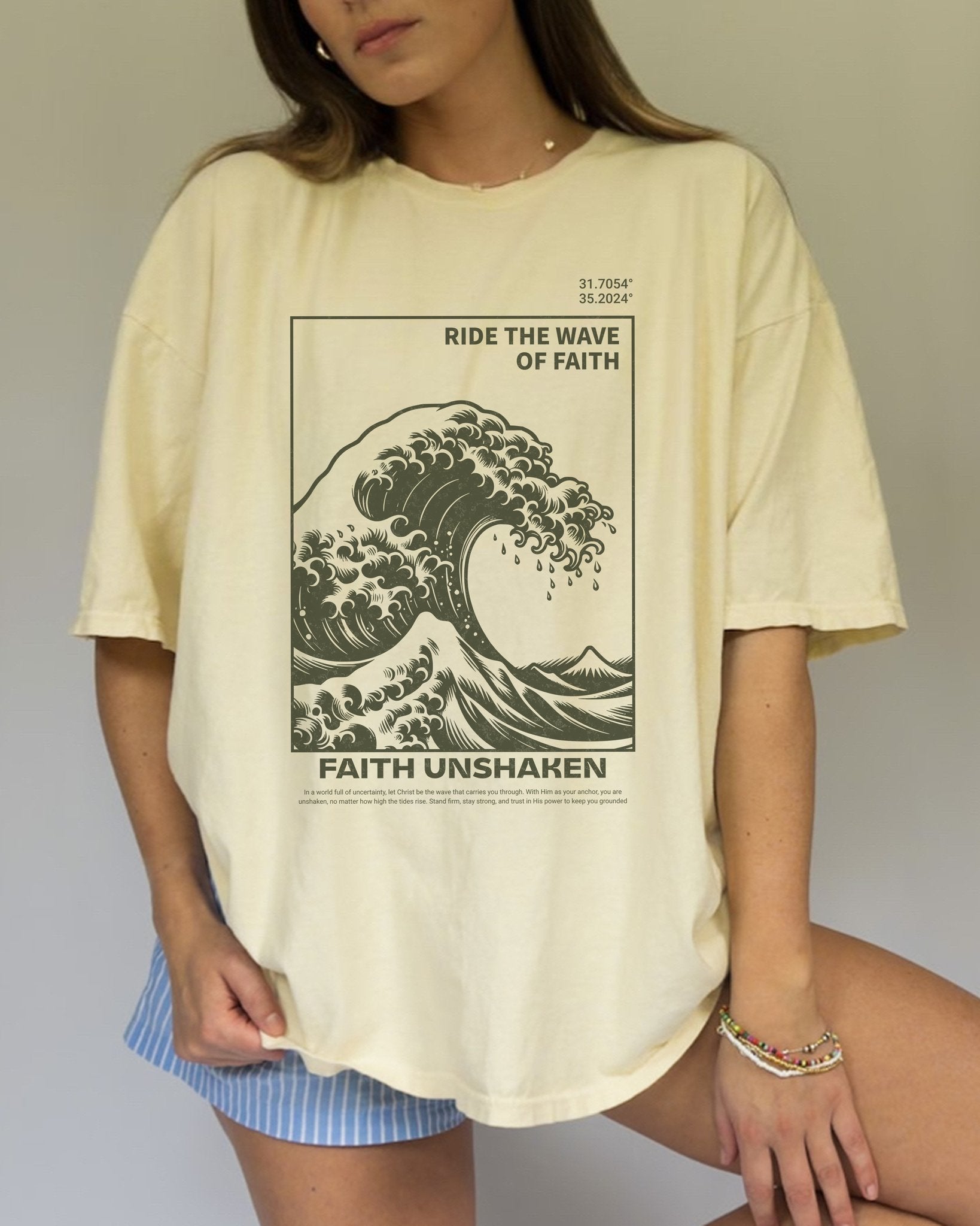 T-shirt with ocean wave design featuring 'Ride The Wave of Faith' and 'Faith Unshaken' text