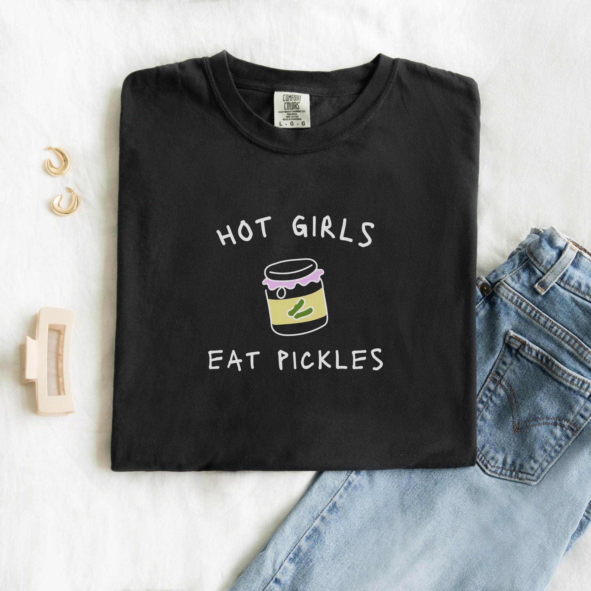 T-shirt with 'Hot Girls Eat Pickles' text and cute pickle jar illustration in pink and yellow