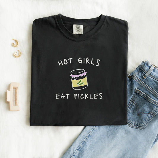 T-shirt with 'Hot Girls Eat Pickles' text and cute pickle jar illustration in pink and yellow