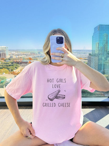 T-shirt with hand-drawn grilled cheese sandwich illustration and text reading Hot Girls Love Grilled Cheese