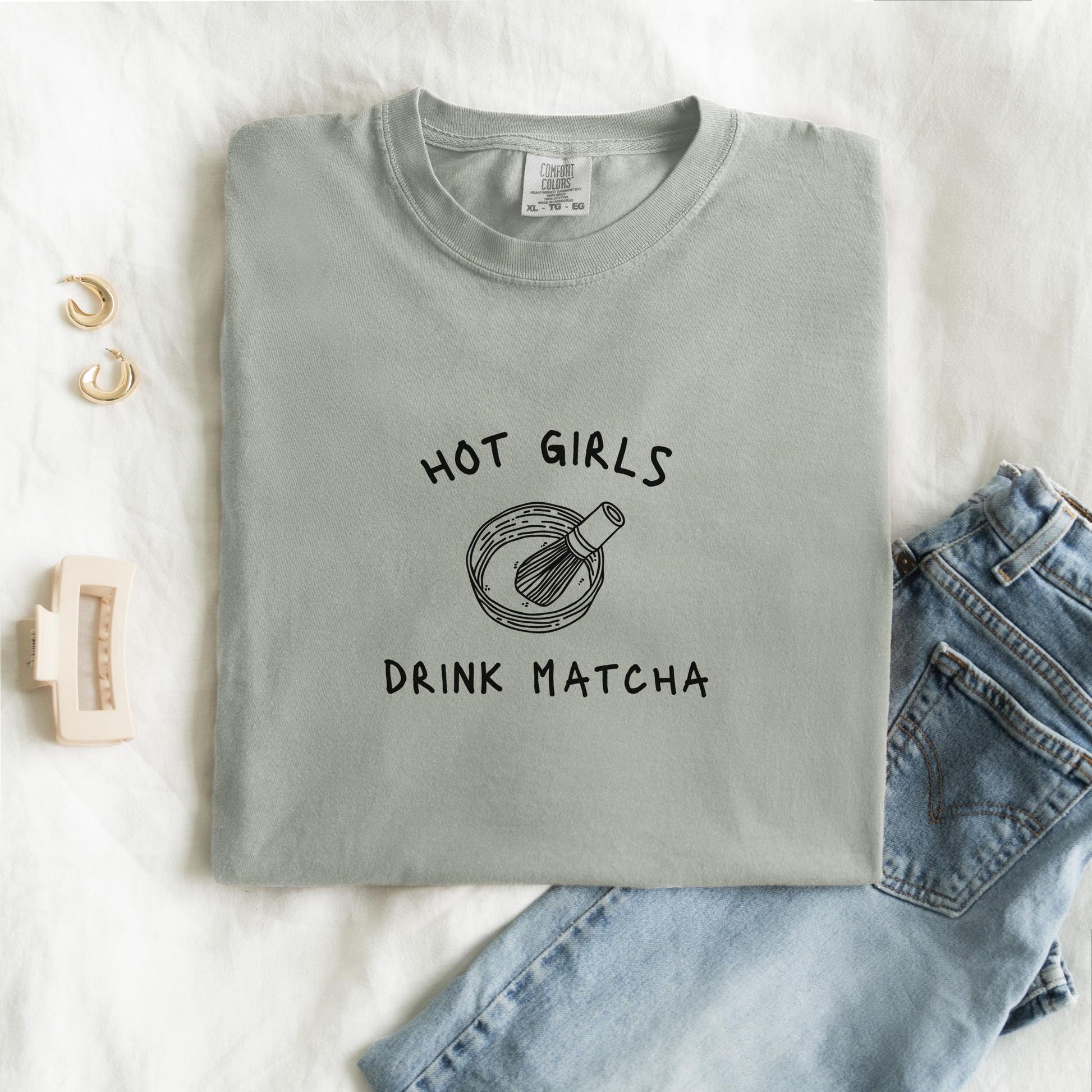 T-shirt with 'Hot Girls Drink Matcha' text and hand-drawn matcha bowl with whisk illustration