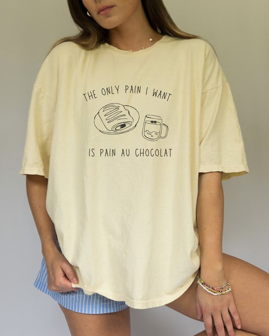 T-shirt with hand-drawn croissant and coffee cup illustration and funny baking text
