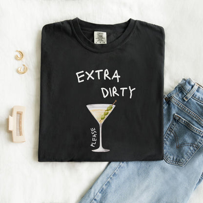 T-shirt design with martini glass filled with clear liquid and three green olives on a pick