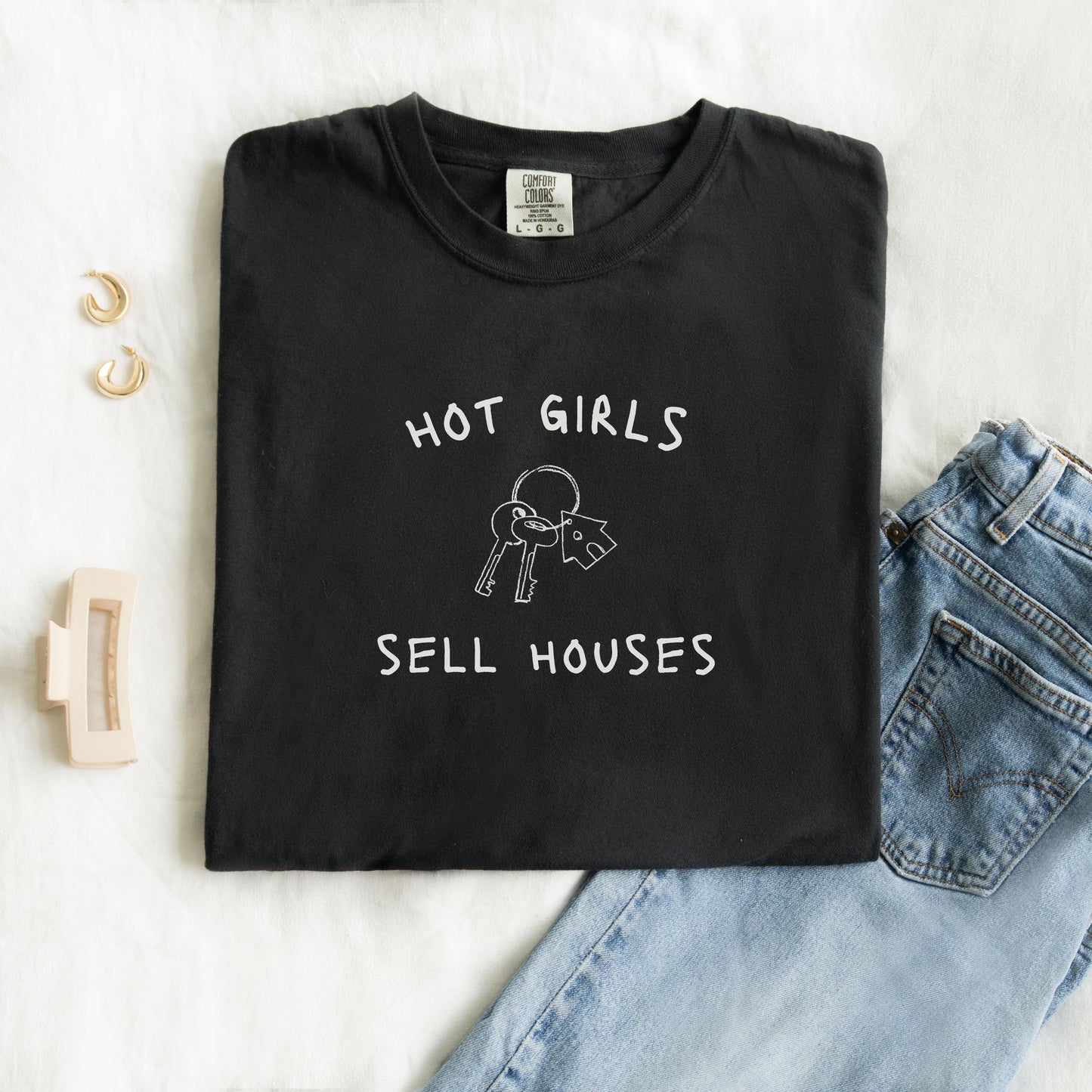 T-shirt with 'Hot Girls Sell Houses' text and hand-drawn house keys illustration in black