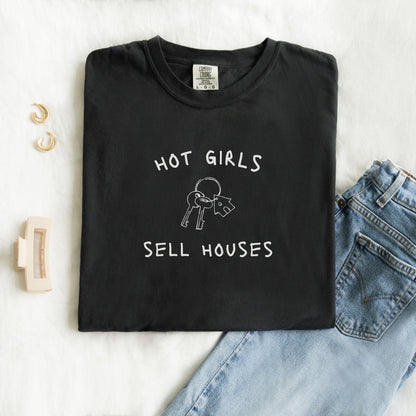 T-shirt with 'Hot Girls Sell Houses' text and hand-drawn house keys illustration in black