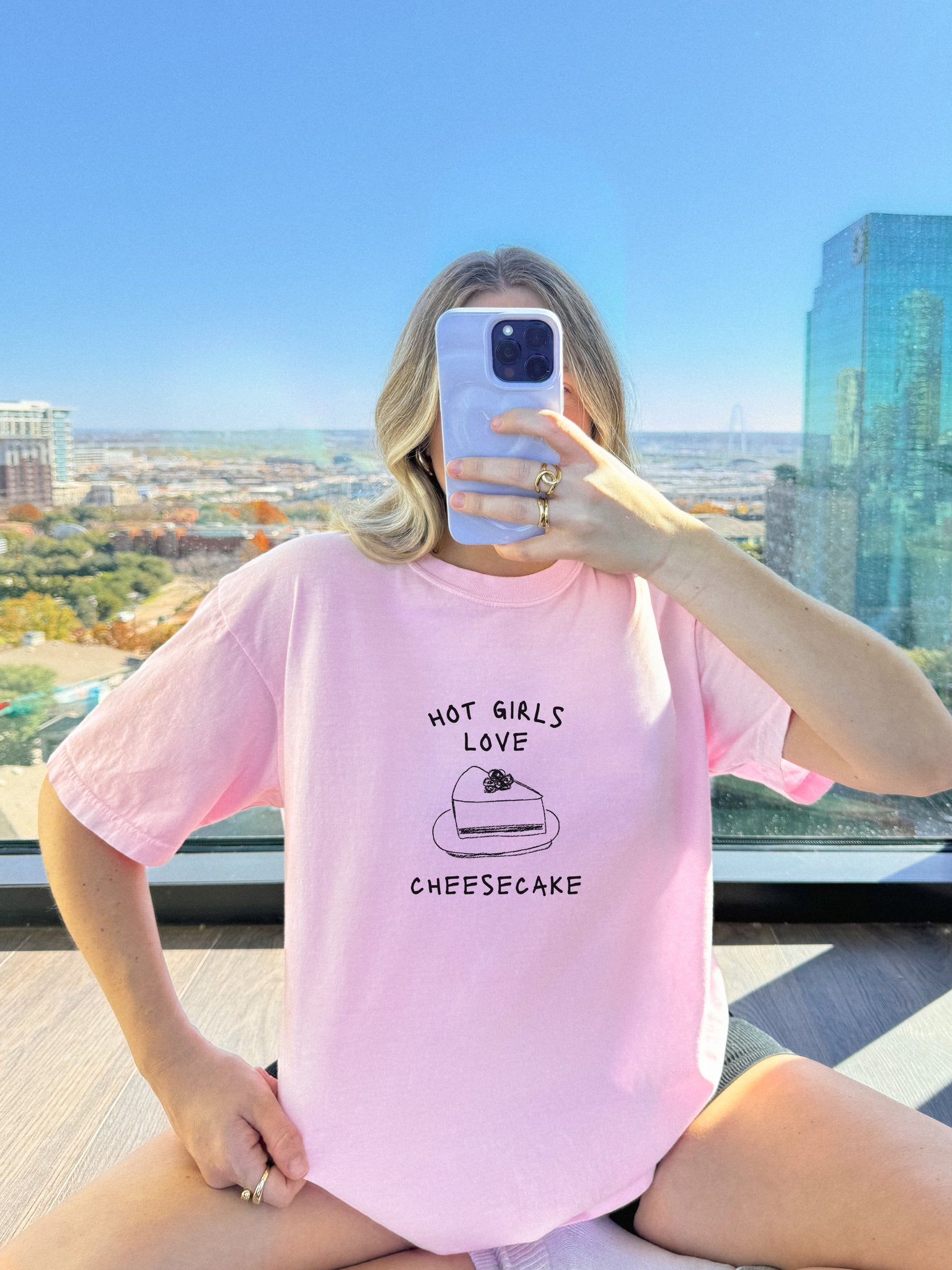 T-shirt with black text reading 'Hot Girls Love' above hand-drawn cheesecake slice illustration