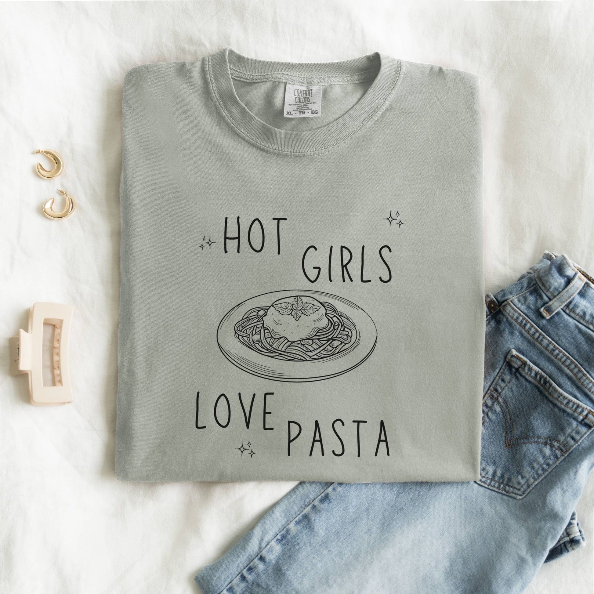 T-shirt design with 'Hot Girls Love Pasta' text and hand-drawn pasta plate illustration with stars