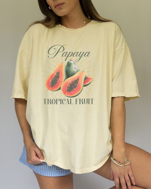 T-shirt featuring watercolor papaya fruits with golden sunburst rays and elegant Papaya script text