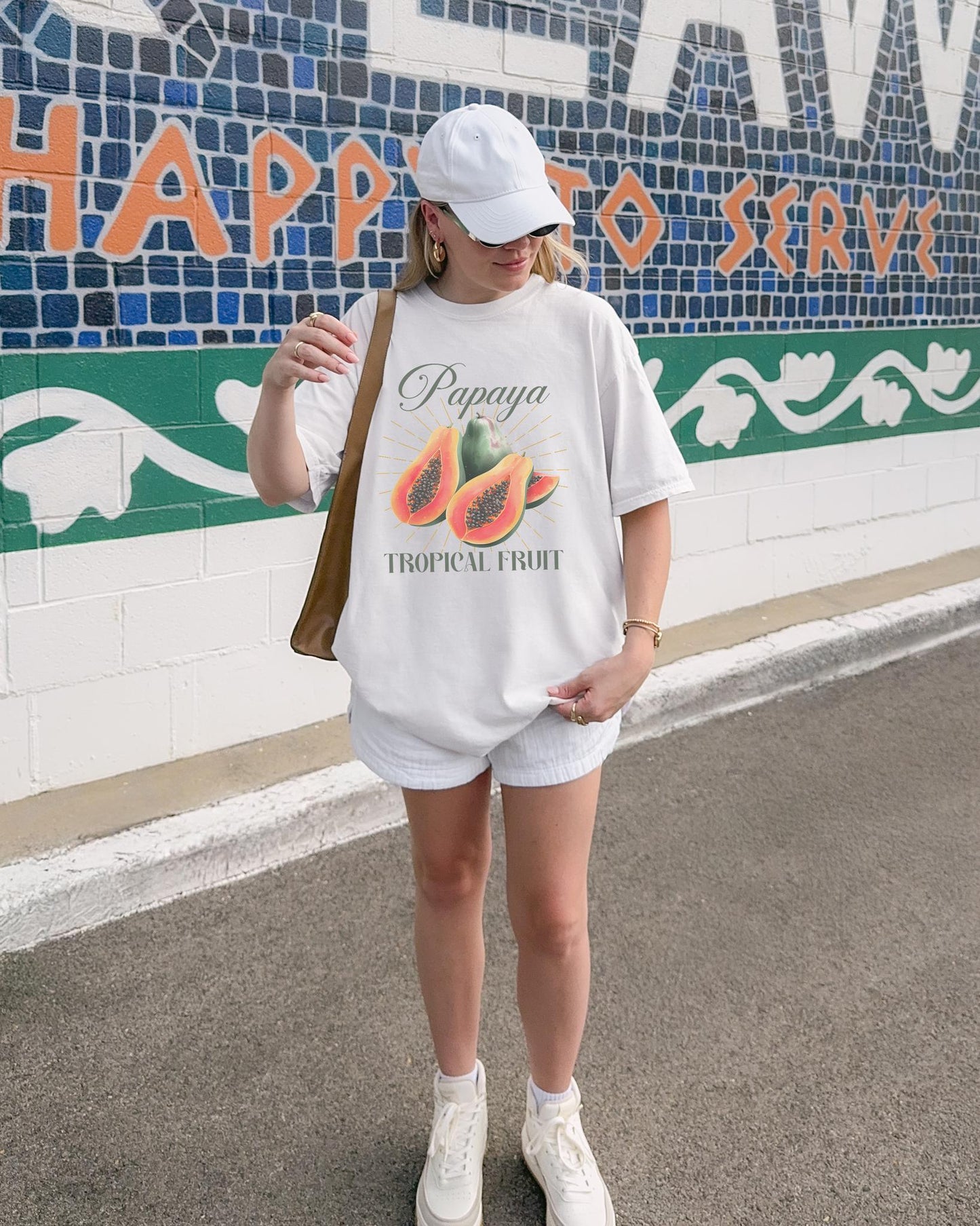 T-shirt featuring watercolor papaya fruits with golden sunburst rays and elegant Papaya script text