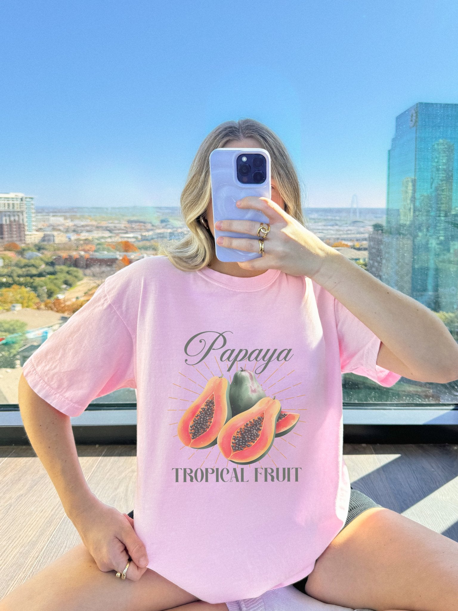T-shirt featuring watercolor papaya fruits with golden sunburst rays and elegant Papaya script text