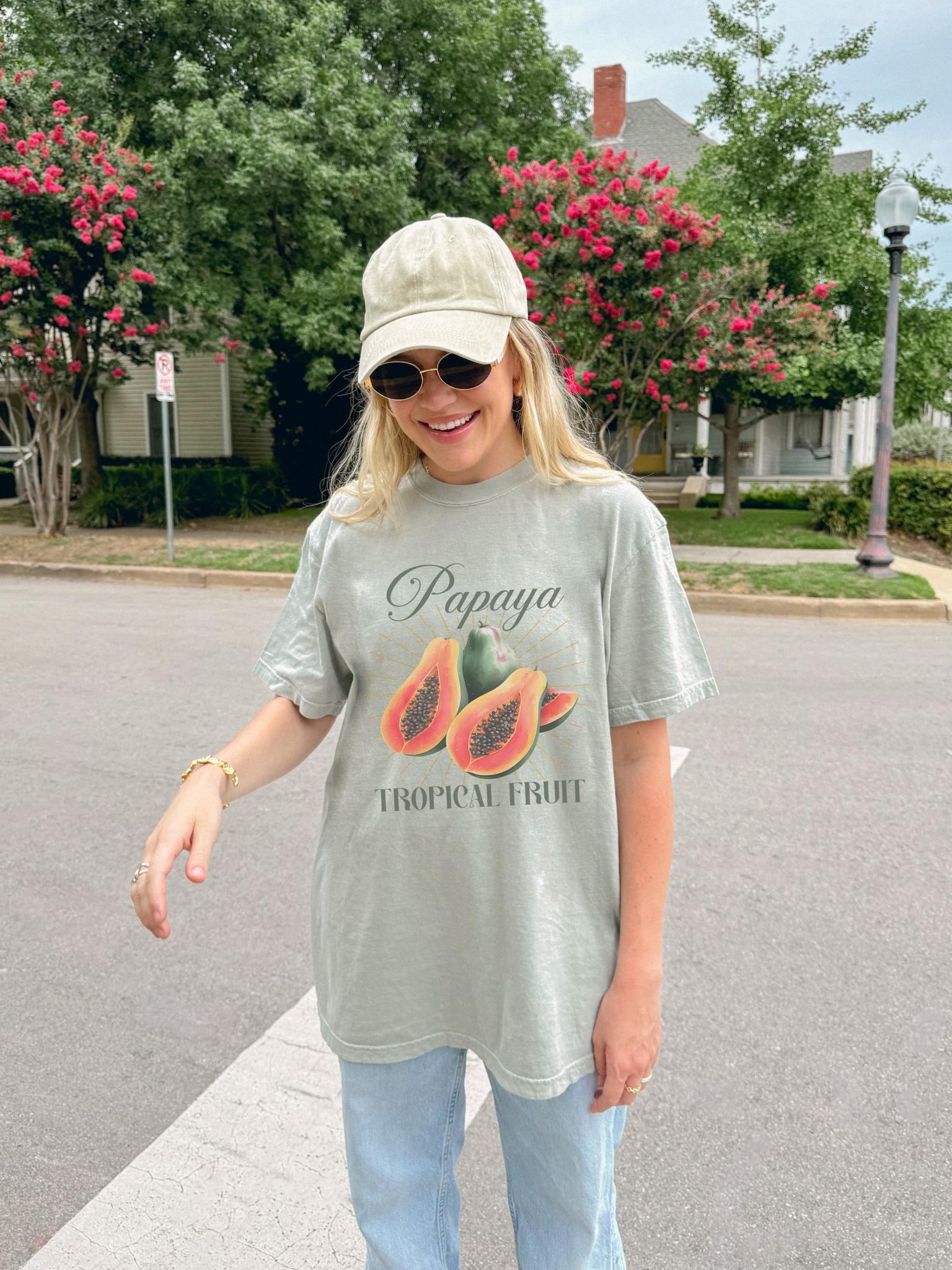 T-shirt featuring watercolor papaya fruits with golden sunburst rays and elegant Papaya script text