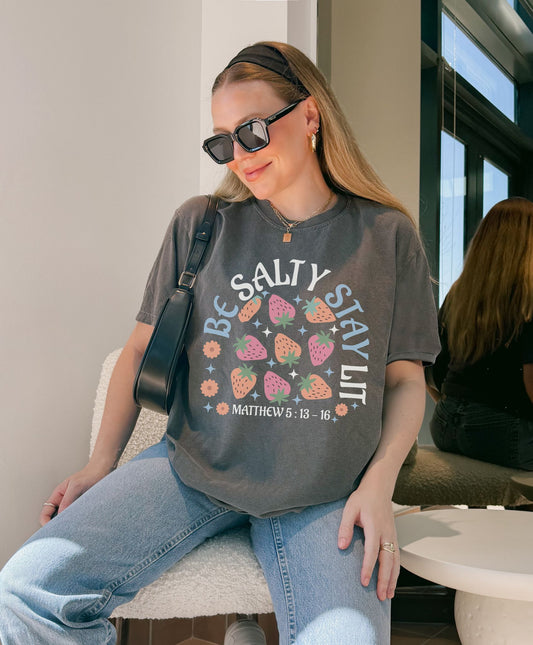 Be Salty t-shirt design with pink and orange strawberries, flowers, and Matthew 5:13-16 scripture