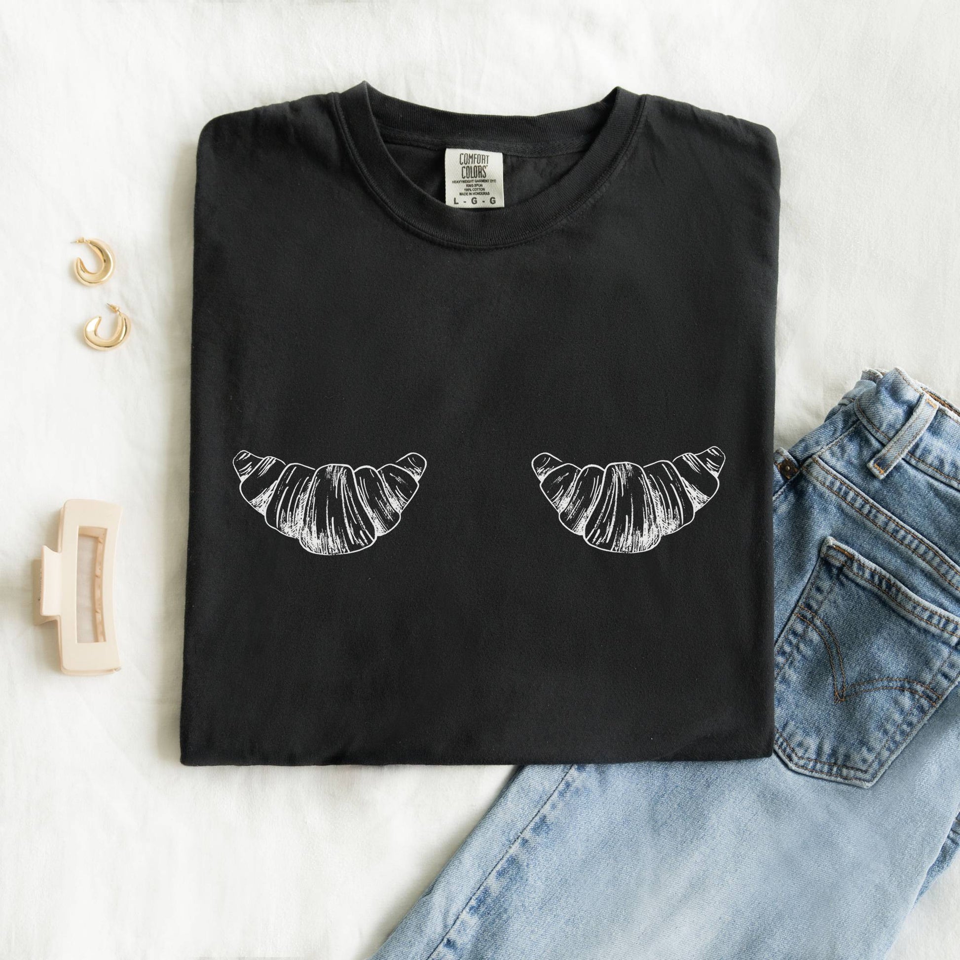 T-shirt with black and white hand-drawn croissant illustrations in vintage sketch style