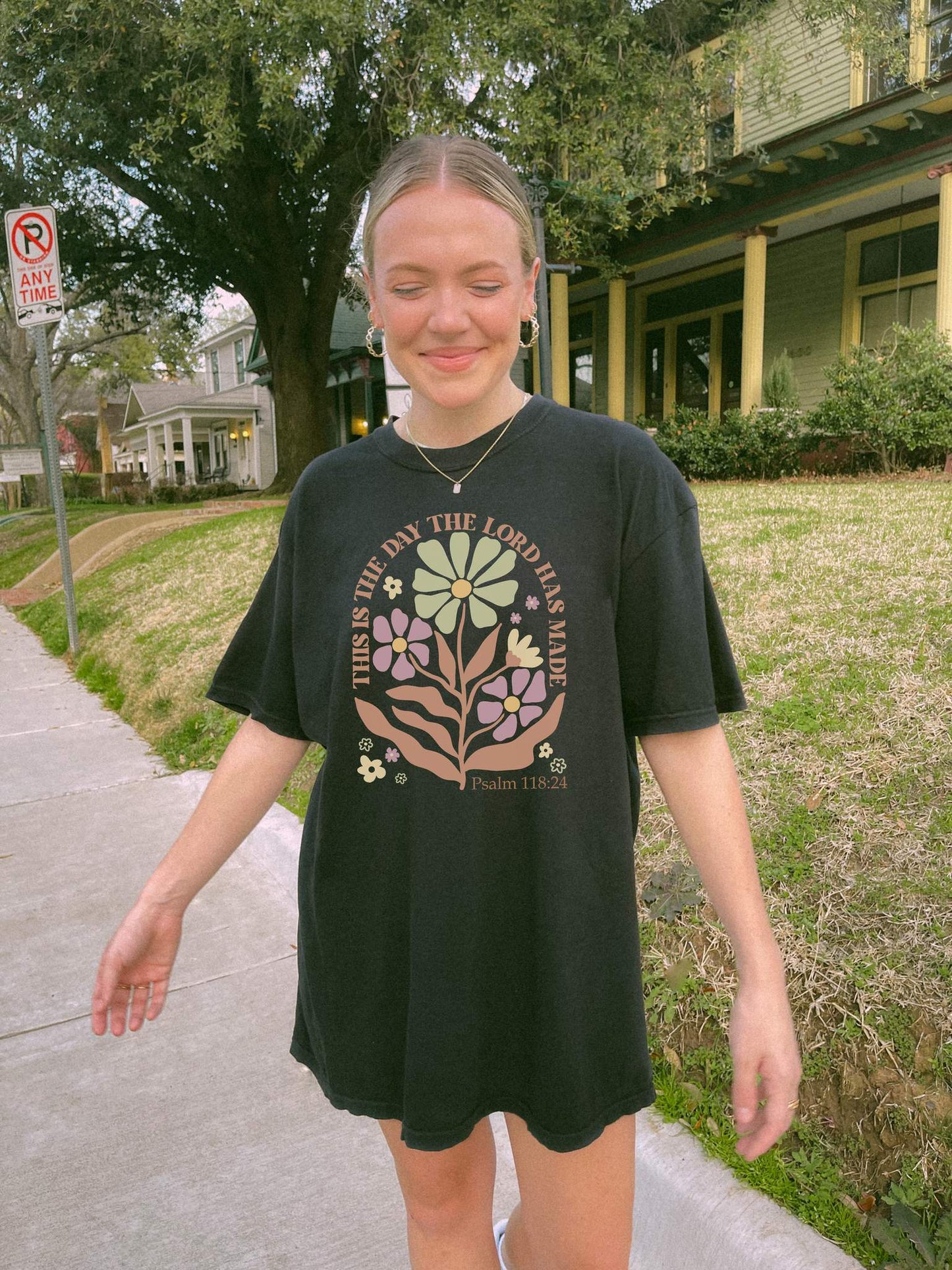 T-shirt with 'This is the Day' text, Psalm 118:24 verse, and floral design with protective hands in sage green, pink, and terracotta colors
