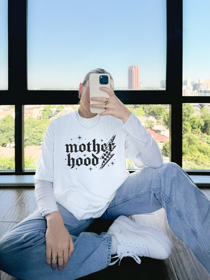 T-shirt with gothic Mother Hood text, lightning bolt graphics, and checkerboard pattern elements