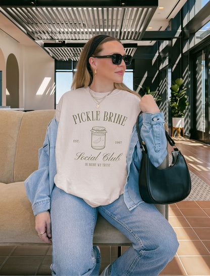 T-shirt with vintage pickle brine social club design featuring mason jar with pickle illustration