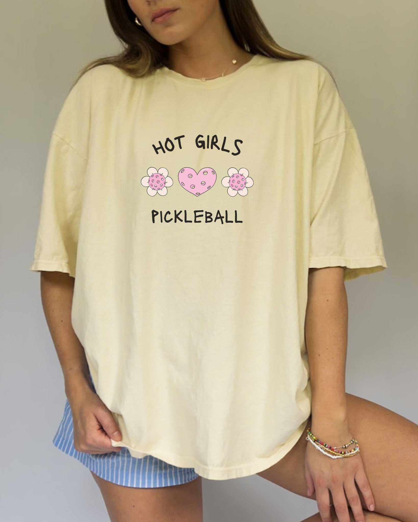 T-shirt with 'Hot Girls Pickleball' text and pink pickleballs designed as flowers and heart