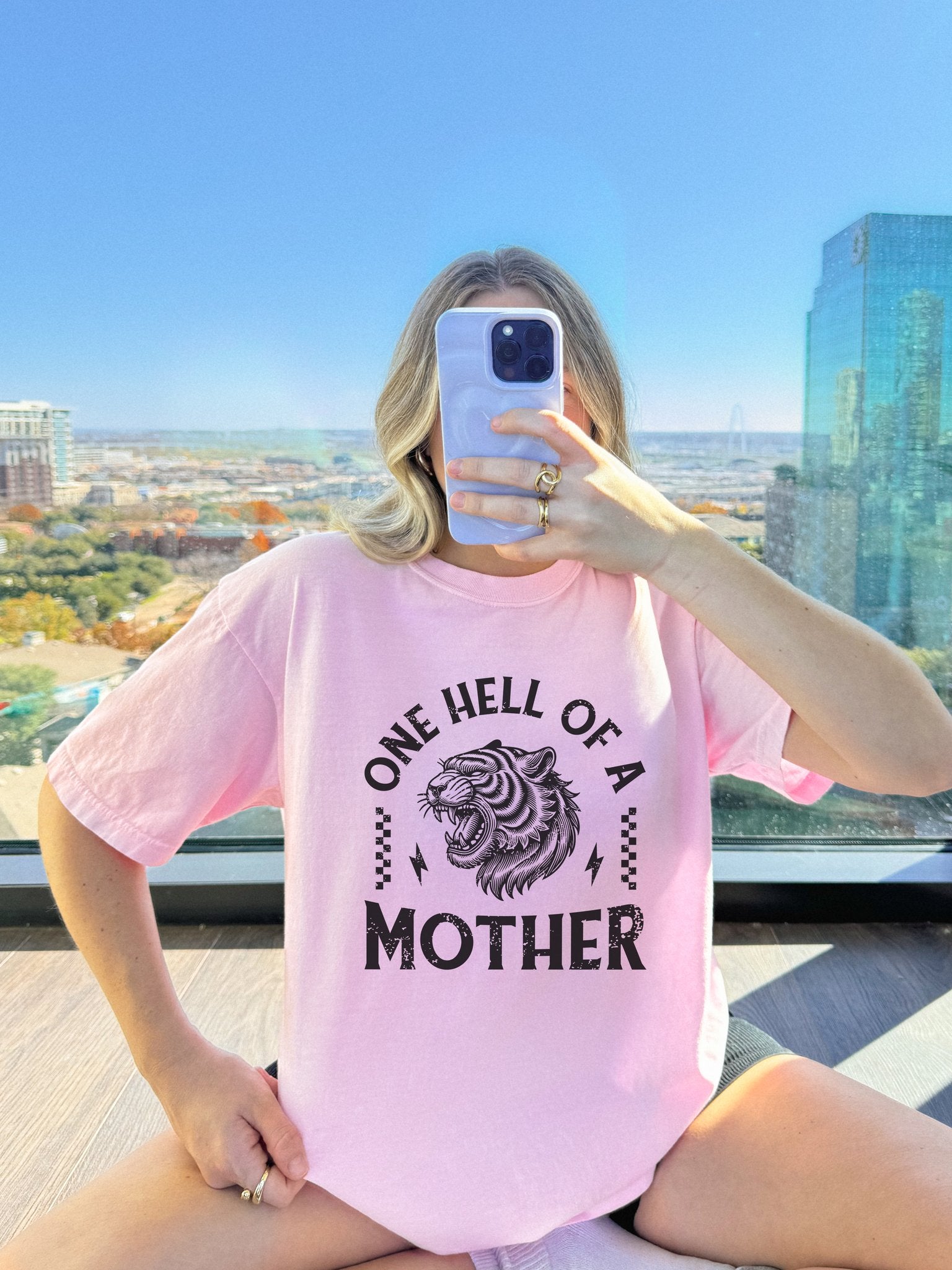 Black and white t-shirt with roaring tiger head and 'One Hell Of A Mother' text in distressed lettering