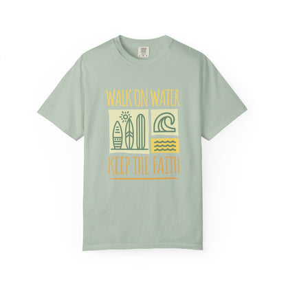 T-shirt with yellow Walk On Water Keep The Faith text, retro surfboard graphics and teal wave designs