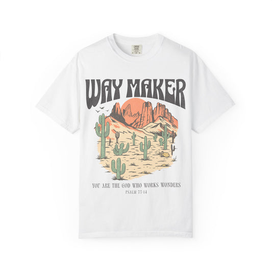 T-shirt with Way Maker text, desert landscape featuring cacti, mountains, and orange sunset with Psalm 77:14 verse