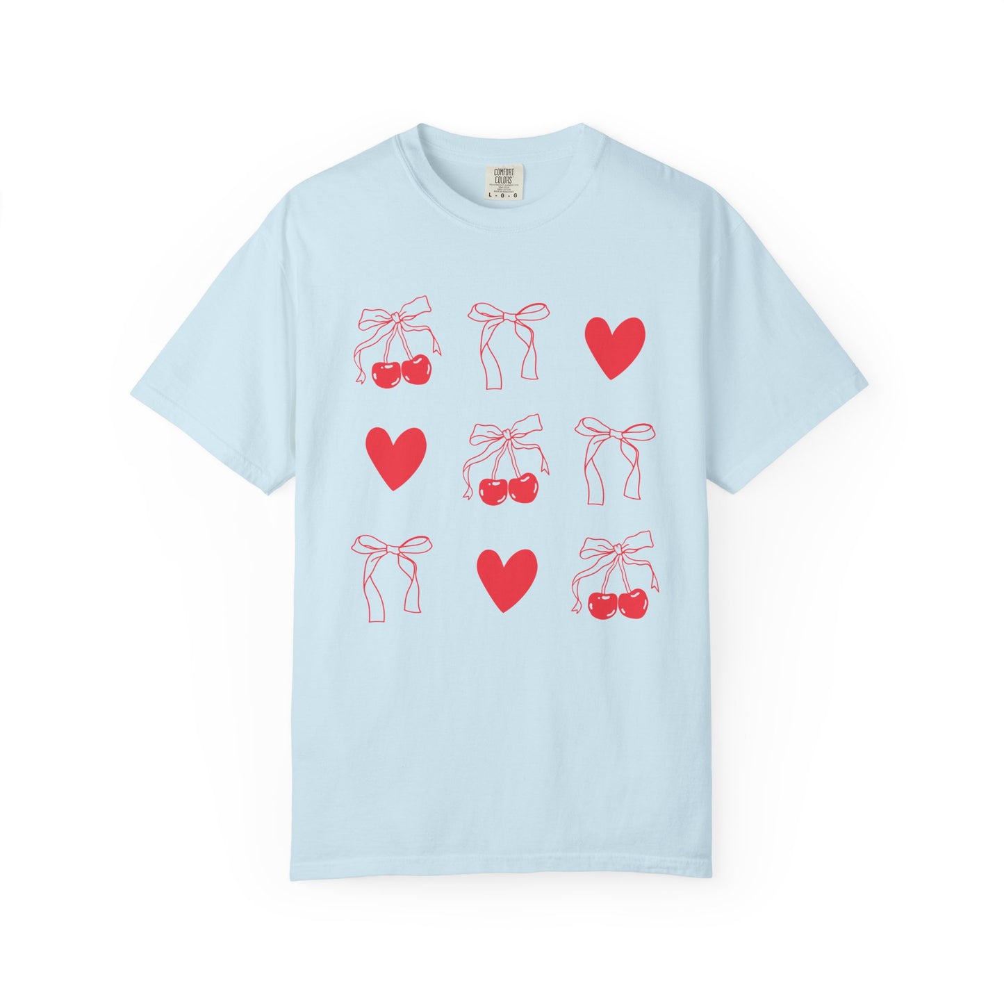 T-shirt with red cherry and bow pattern featuring hearts and ribbon bow designs