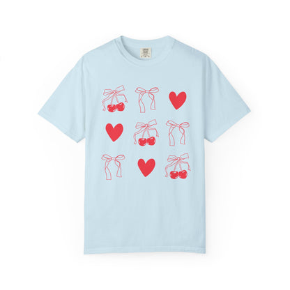 T-shirt with red cherry and bow pattern featuring hearts and ribbon bow designs