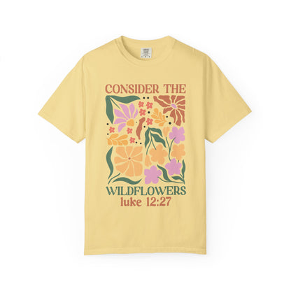 T-shirt with colorful wildflower design and 'Consider the Wildflowers Luke 12:27' bible verse text