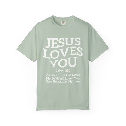 Black text design on t-shirt reading Jesus Loves You with John 15:9 Bible verse