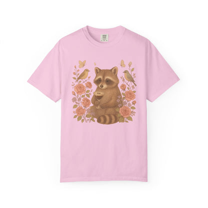 T-shirt with raccoon holding espresso martini glass surrounded by pink roses and birds