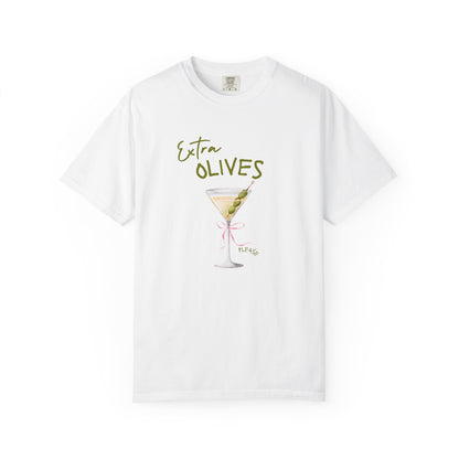 T-shirt design with martini glass, green olives, and pink bow saying Extra Olives Please
