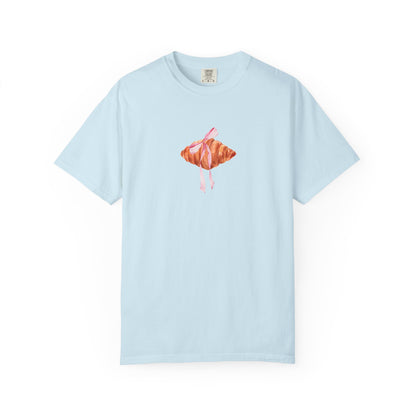 T-shirt with watercolor croissant design featuring golden brown pastry with pink ribbon bow