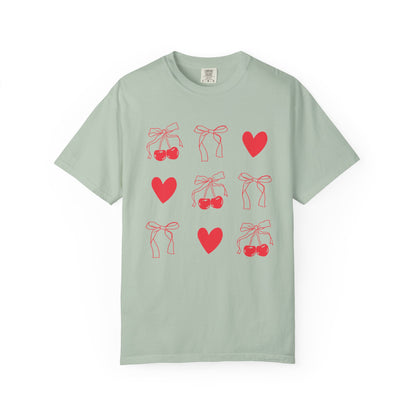 T-shirt with red cherry and bow pattern featuring hearts and ribbon bow designs